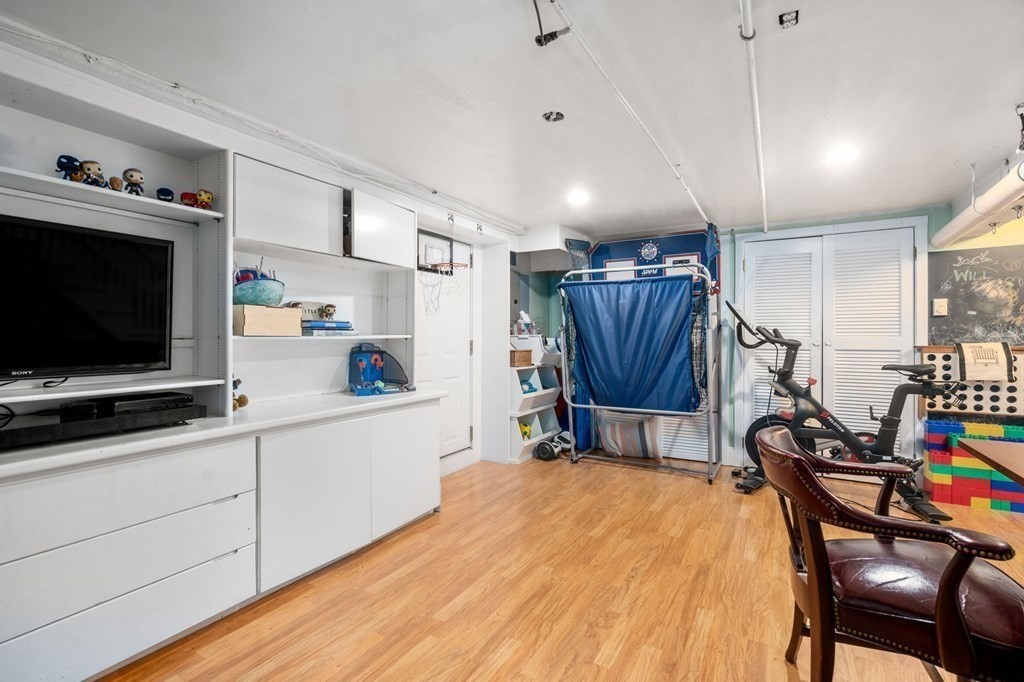 32 Verndale Road Newton, MA 02461 - Photo 19 of 33 a room with furniture and a flat screen tv