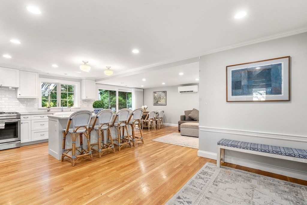 32 Verndale Road Newton, MA 02461 - Photo 3 of 33 a living room with furniture a wooden floor and a fireplace