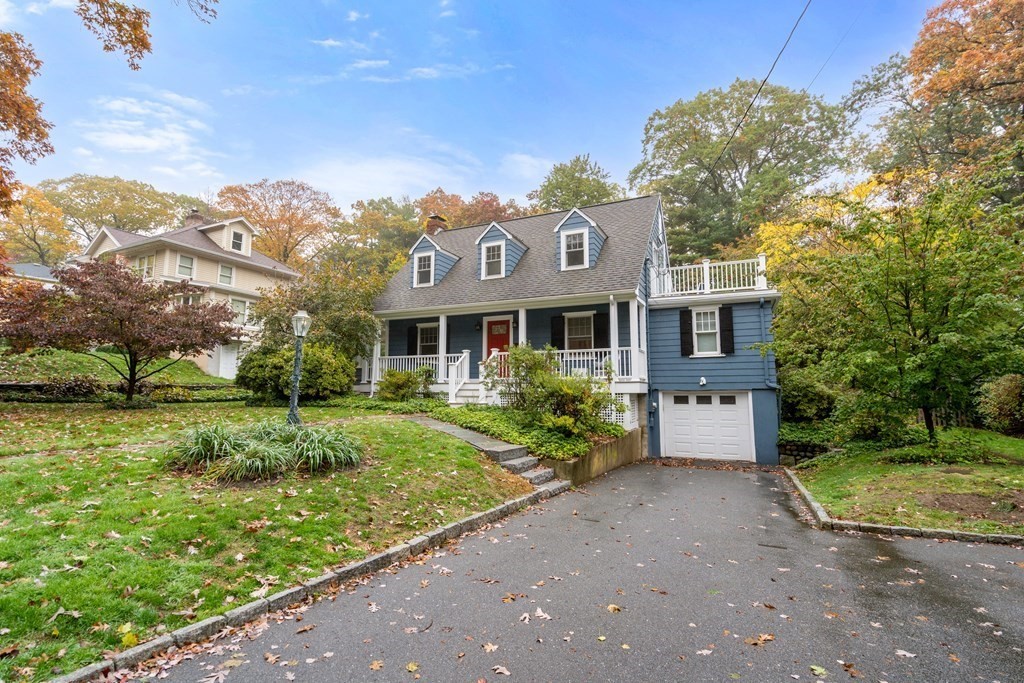 32 Verndale Road Newton, MA 02461 - Photo 31 of 33 a front view of a house with a yard and potted plants