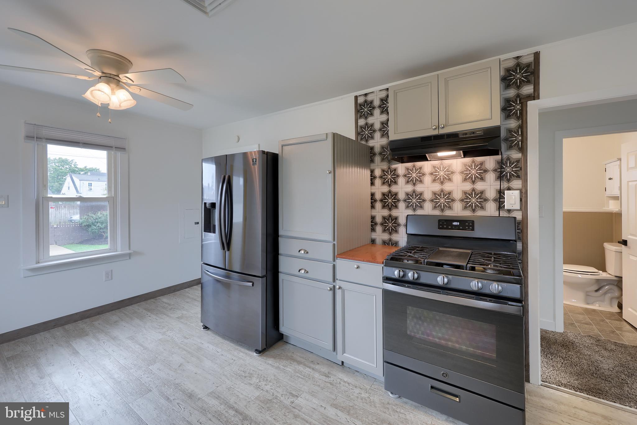1802 Filbert Street York, PA 17404 - Photo 14 of 30 a kitchen with granite countertop a refrigerator stove and sink