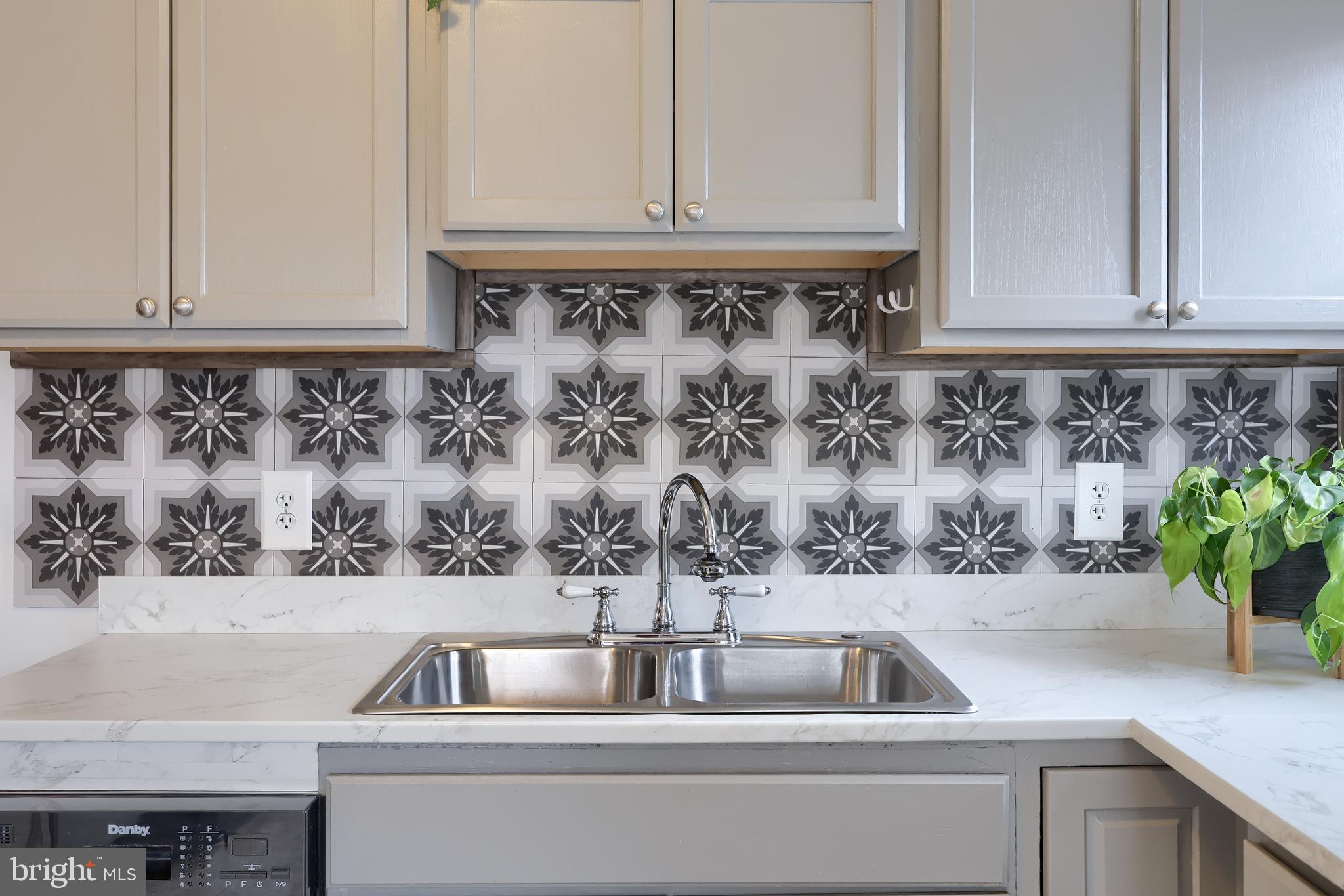 1802 Filbert Street York, PA 17404 - Photo 23 of 30 a kitchen sink with a granite counter top and a potted plant
