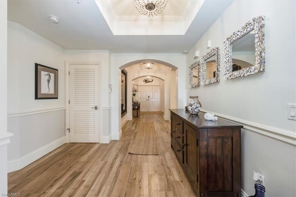a view of a hallway view with wooden floor and staircase