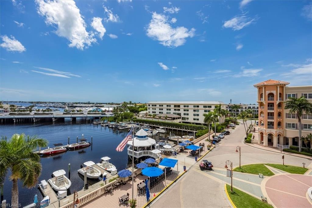 451 Bayfront Place, Unit 5407 Naples, FL 34102 - Photo 12 of 21 a view of a balcony with dining table and chairs