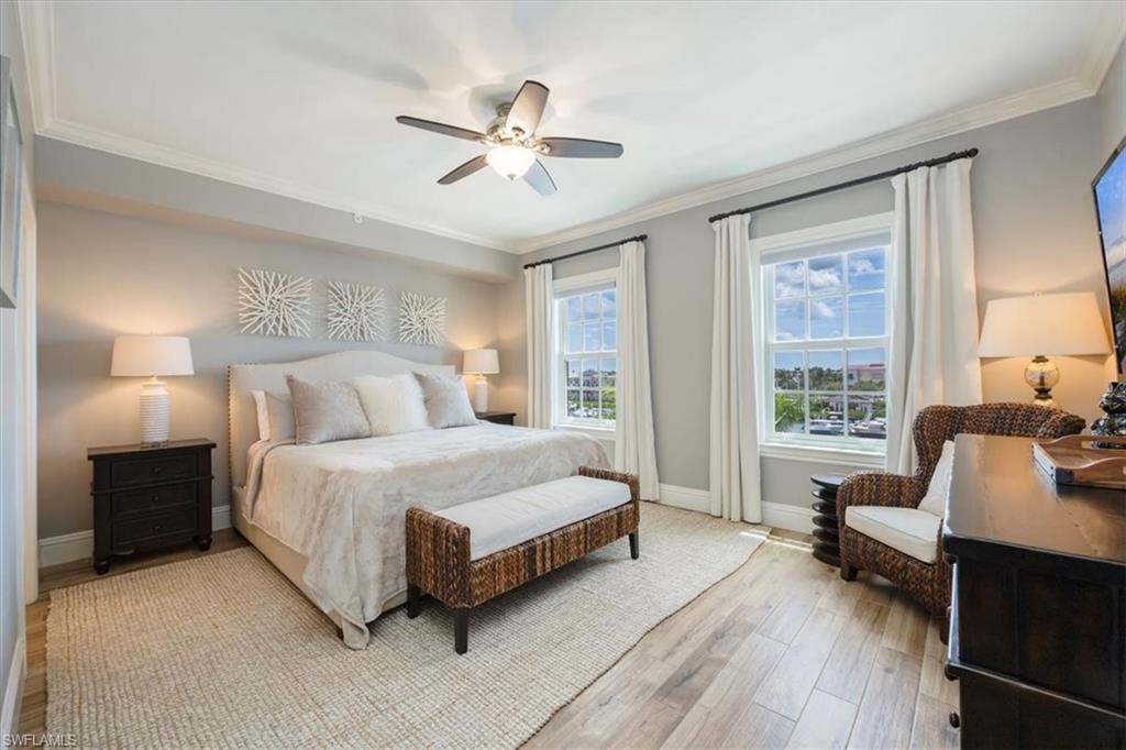 451 Bayfront Place, Unit 5407 Naples, FL 34102 - Photo 6 of 21 a bedroom with a bed and furniture