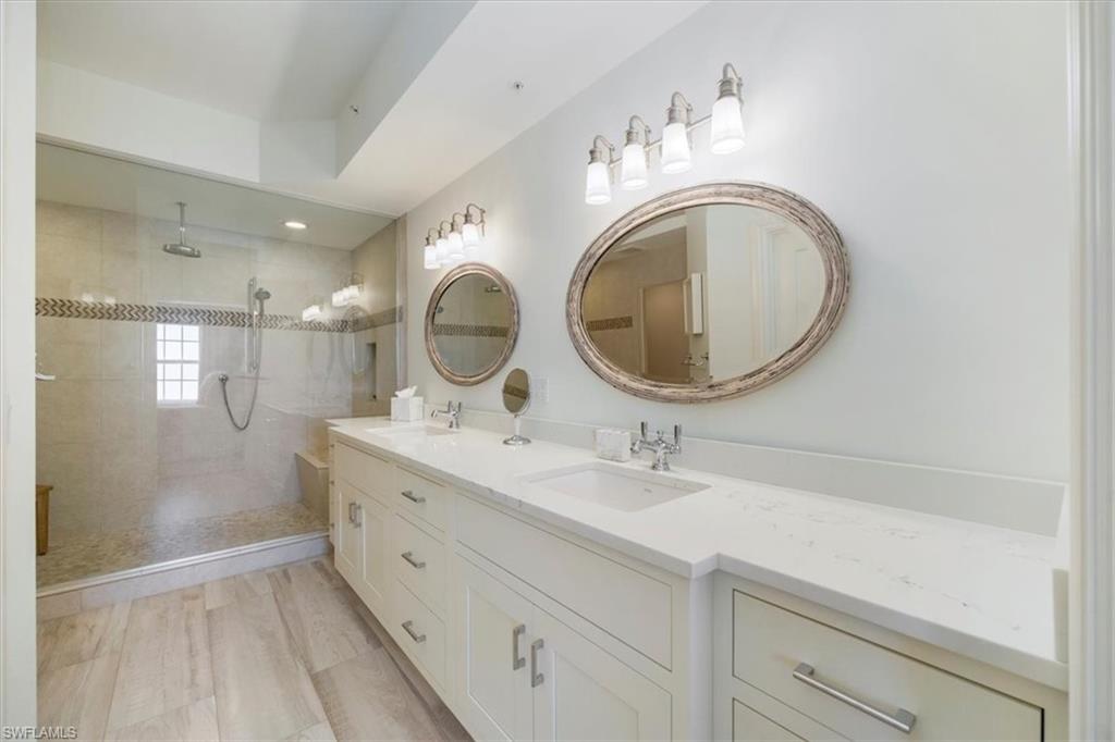451 Bayfront Place, Unit 5407 Naples, FL 34102 - Photo 7 of 21 a bathroom with a sink and a mirror