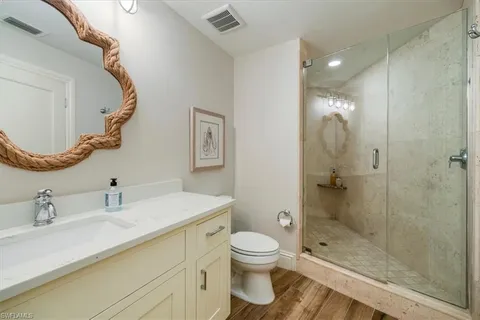 a bathroom with a sink toilet and shower