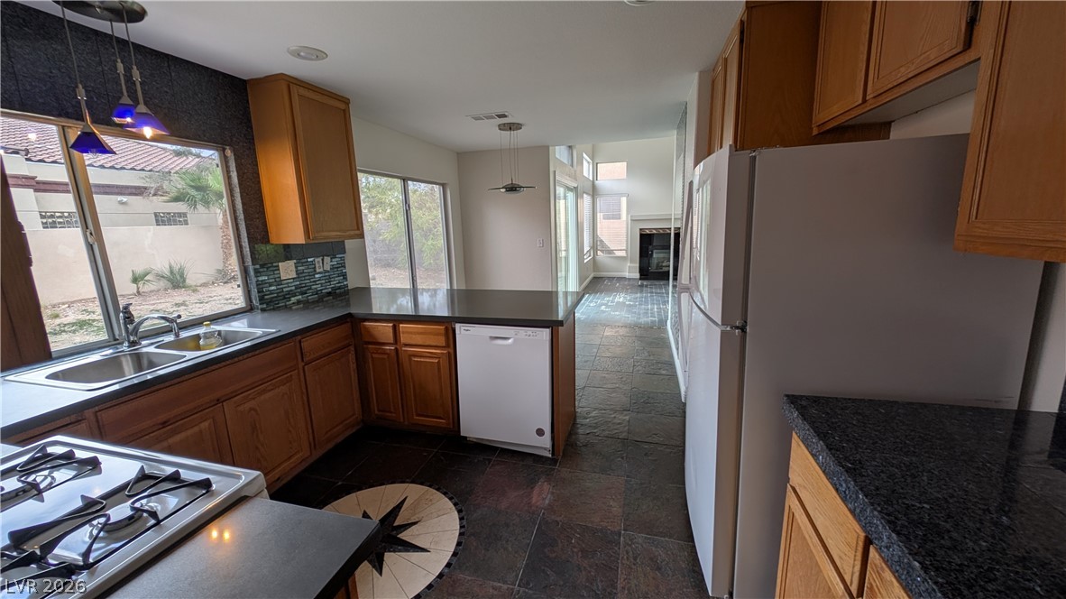 2670 Ridgewater Circle Henderson, NV 89074 - Photo 8 of 22 This kitchen boasts ample cabinet space, a functional layout, and easy access to an adjoining living area.