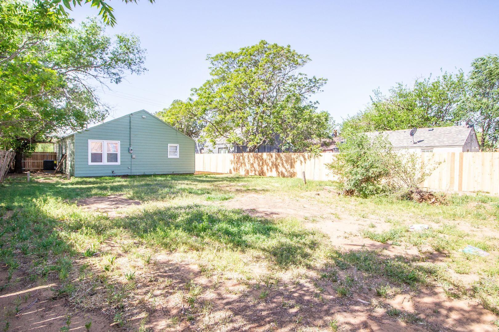 1918 20th Street Lubbock, TX 79411 - Photo 13 of 13 a view of house with backyard and tree