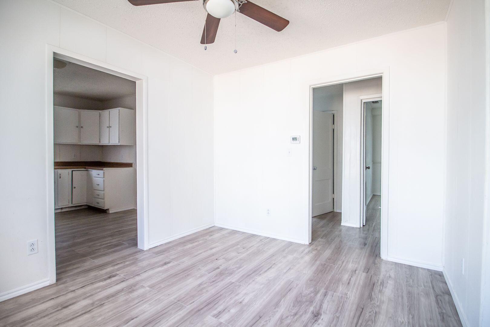 1918 20th Street Lubbock, TX 79411 - Photo 8 of 13 a view of empty room with wooden floor