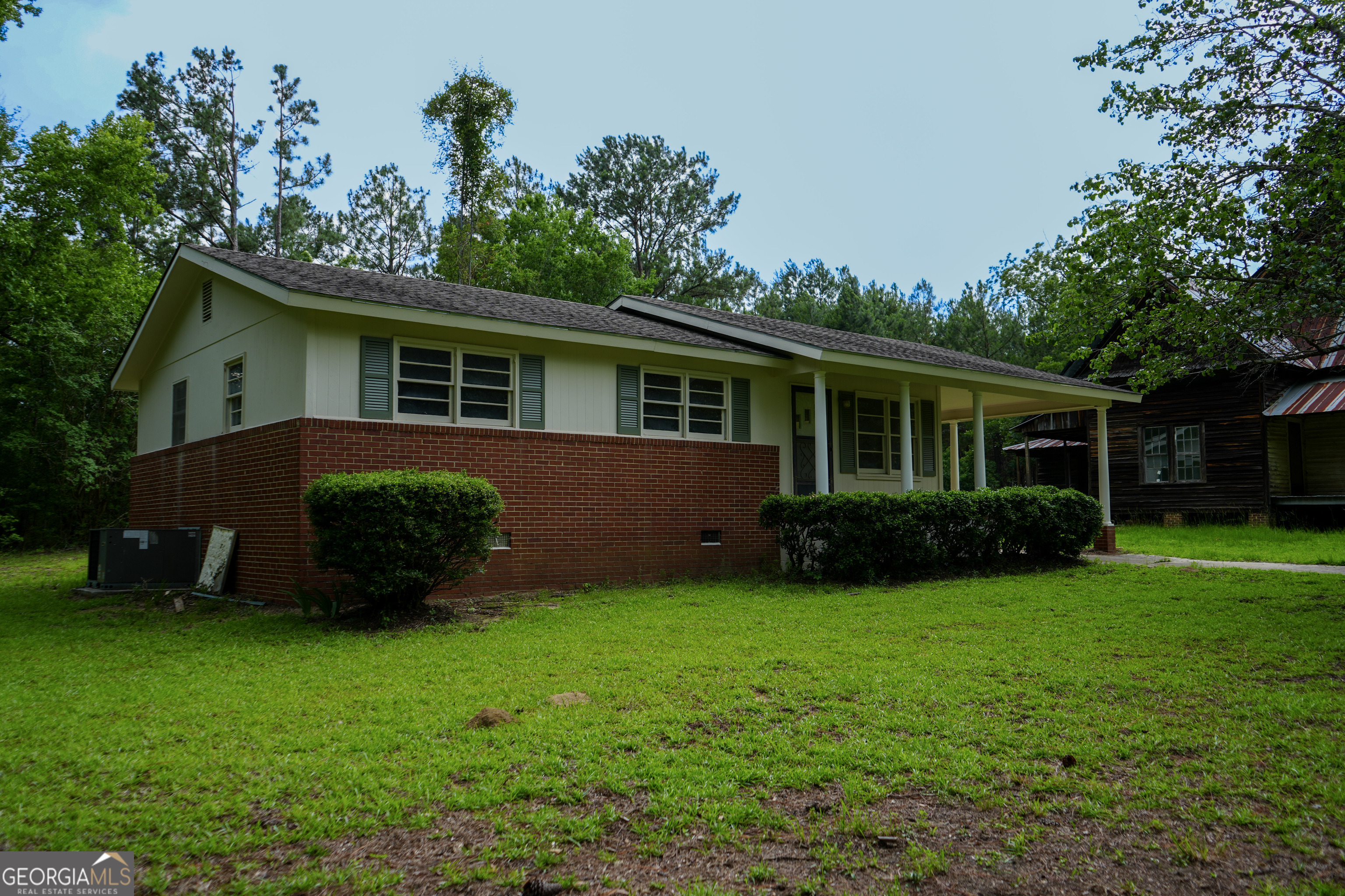 1869 Minter Blue Springs Road Rockledge, GA 30454 - Photo 10 of 45 a view of a house with a yard and a garden