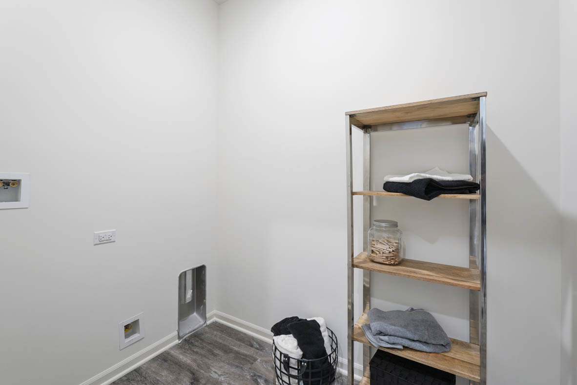 303 Ridley Street North Aurora, IL 60542 - Photo 13 of 36 a room that has a bed and a chair in it