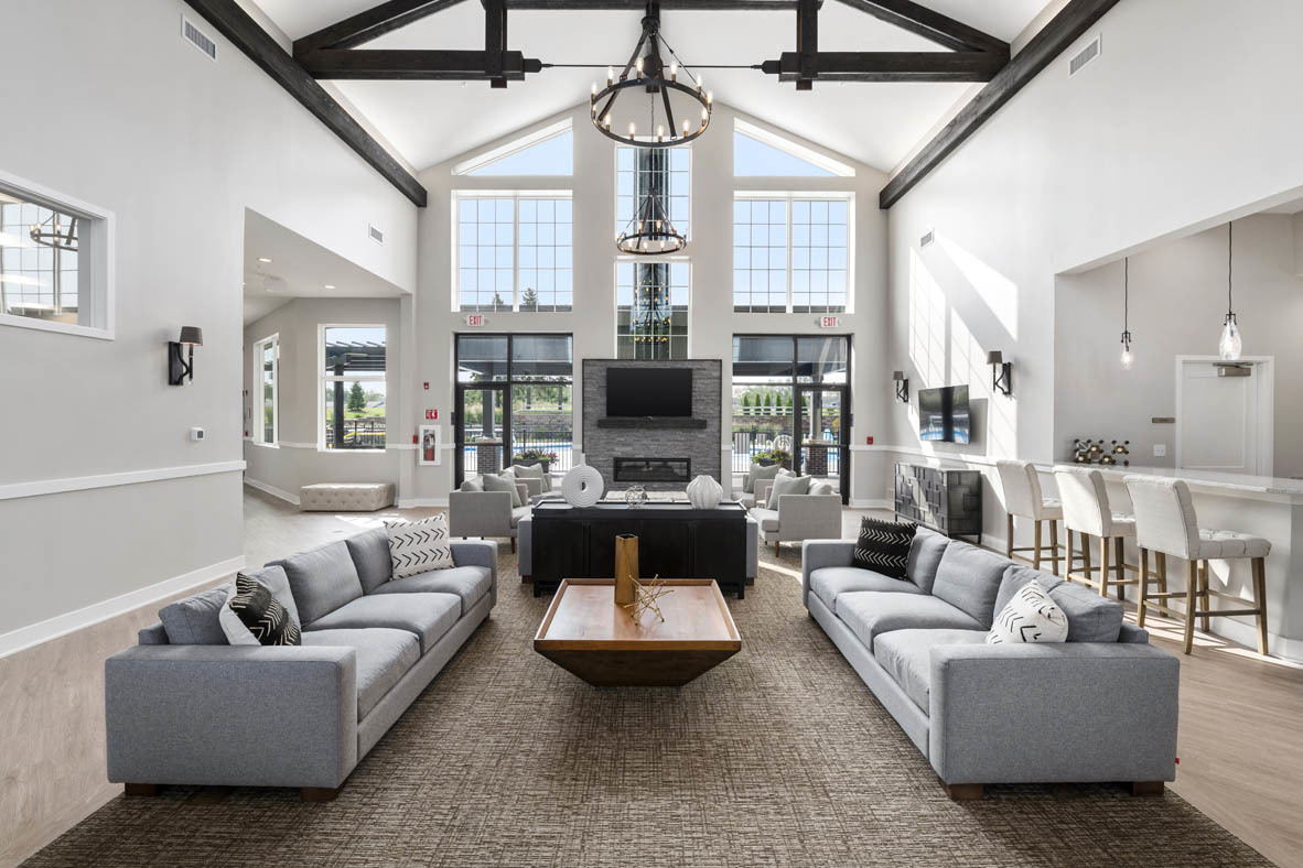 303 Ridley Street North Aurora, IL 60542 - Photo 18 of 36 a living room with furniture a fireplace and a chandelier