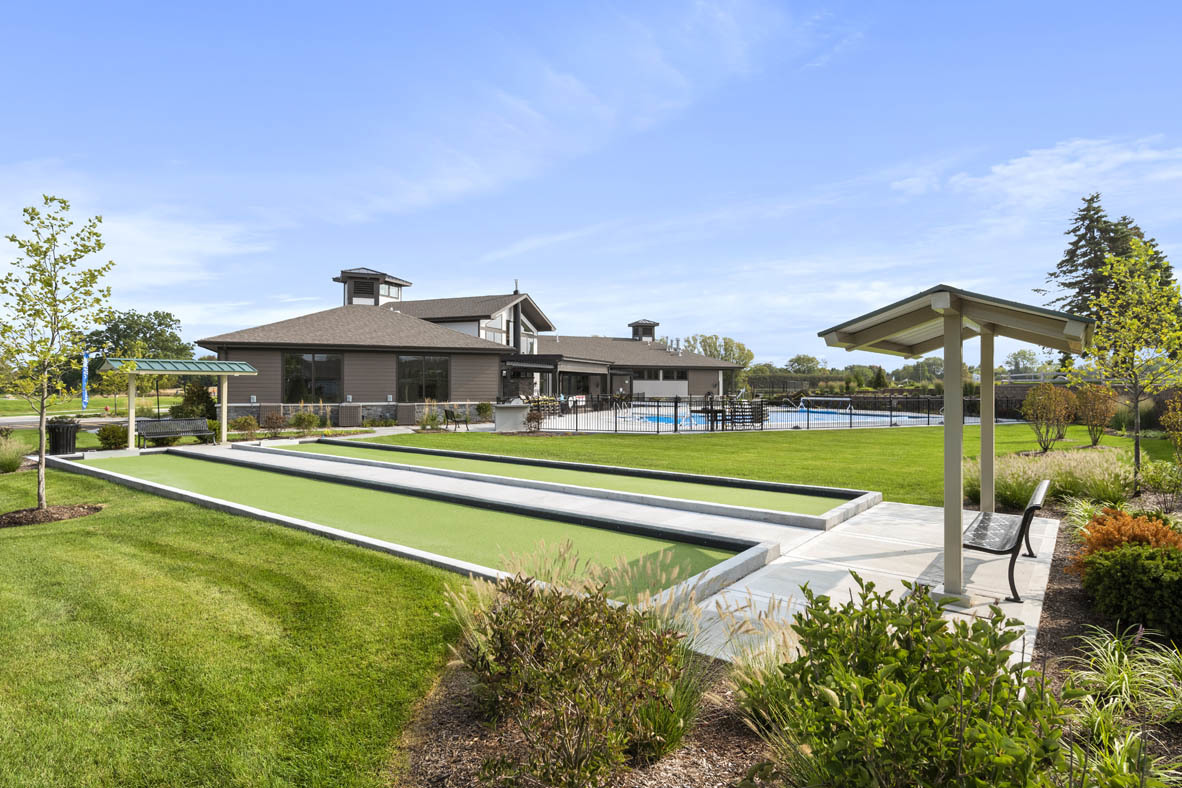 303 Ridley Street North Aurora, IL 60542 - Photo 26 of 36 a view of swimming pool with lawn chairs and large trees