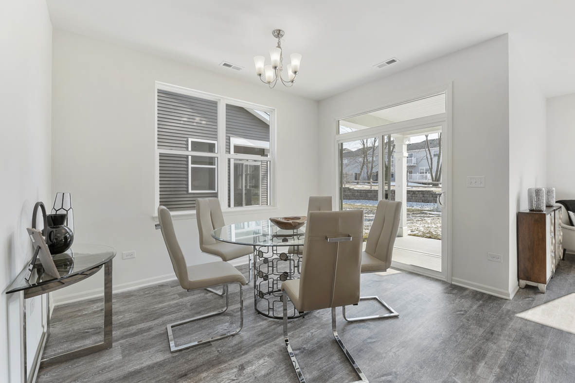 303 Ridley Street North Aurora, IL 60542 - Photo 6 of 36 a view of a dining room with furniture window and outside view