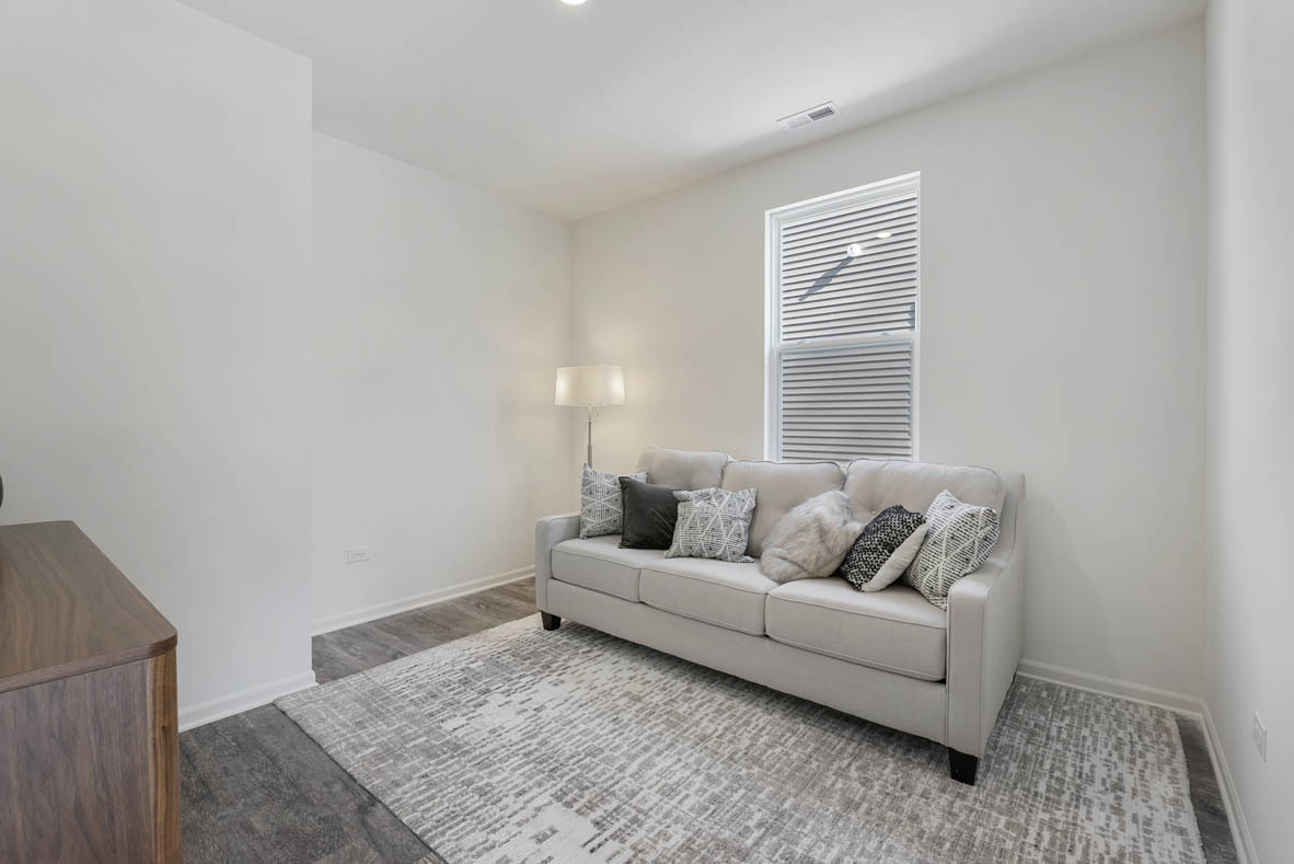 303 Ridley Street North Aurora, IL 60542 - Photo 10 of 36 a living room with furniture and a couch
