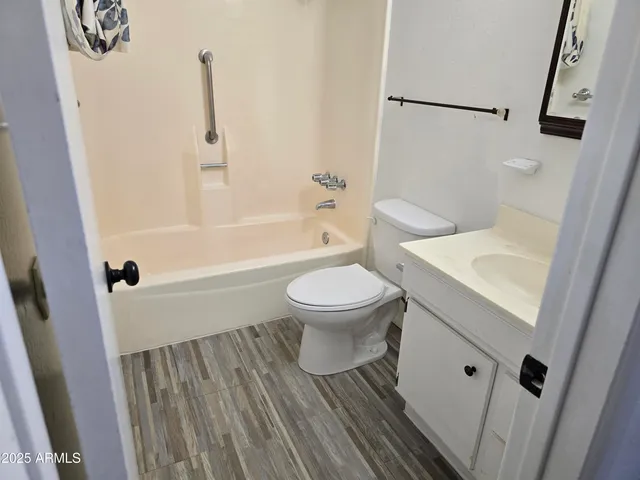 a bathroom with a sink a toilet and a bathtub