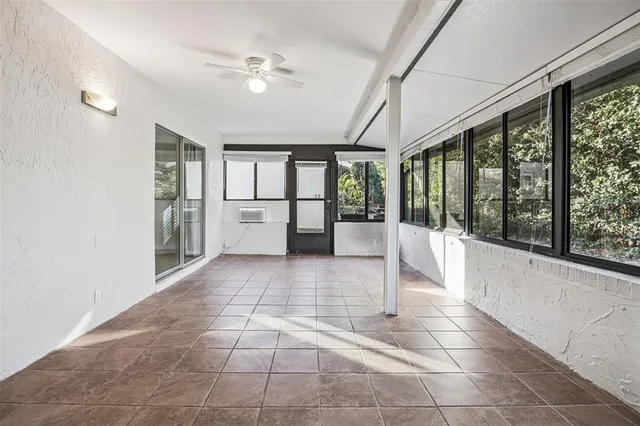 a view of open kitchen with a sink and refrigerator