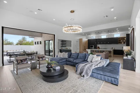 a kitchen with stainless steel appliances kitchen island granite countertop a sink and a stove