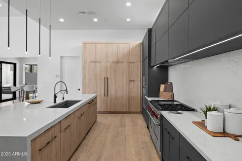 a utility room with sink dryer and washer