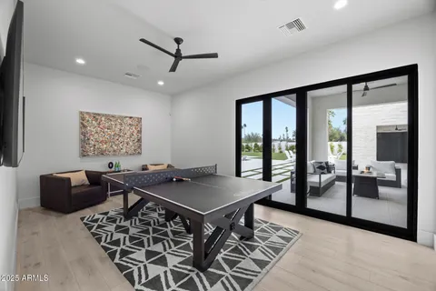 a view of walk in closet with clothes