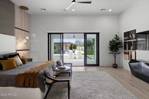 a view of a house with swimming pool and sitting area