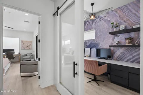 a view of a swimming pool with outdoor seating and plants