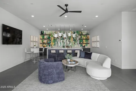 a kitchen with a stove and a wooden floor