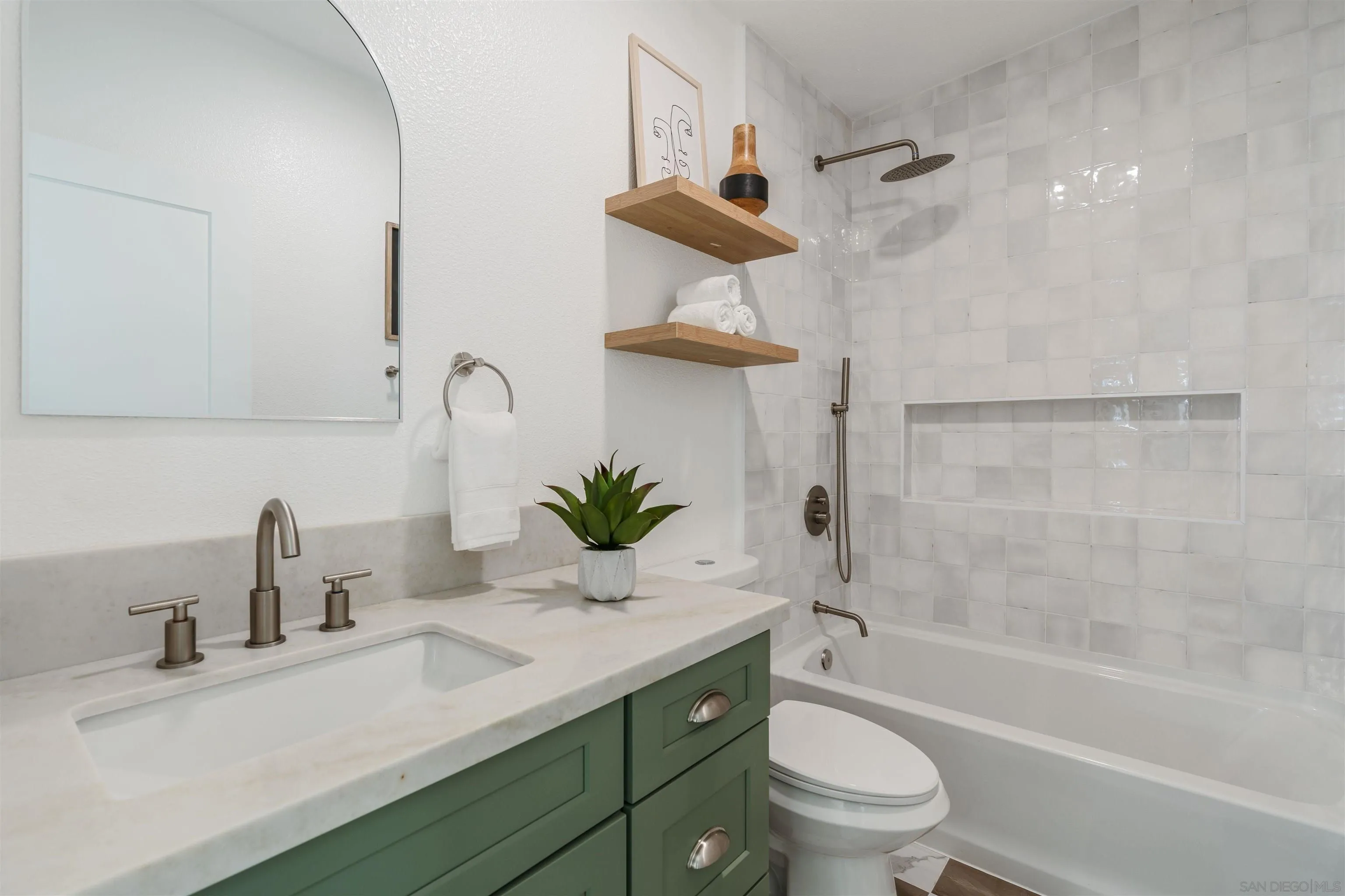 1426 Santa Rosa Street Oceanside, CA 92058 - Photo 51 of 73 a bathroom with a sink a toilet and a bathtub