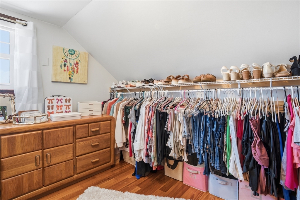 60 Wingold Street Fall River, MA 02720 - Photo 19 of 40 a view of walk in closet with clothes and shoes