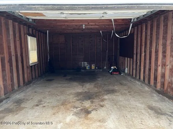 a view of a room with wooden walls