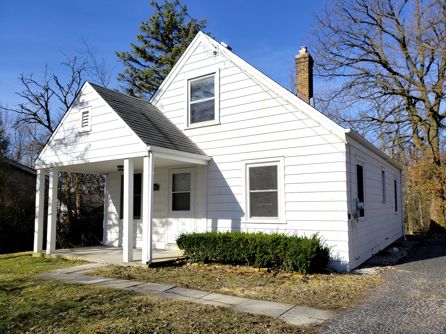 18244 Stewart Avenue Homewood, IL 60430 - Photo 1 of 16 a front view of a house with a yard