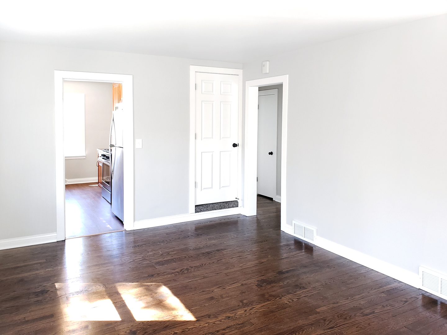18244 Stewart Avenue Homewood, IL 60430 - Photo 6 of 16 a view of interior space with wooden floor and windows