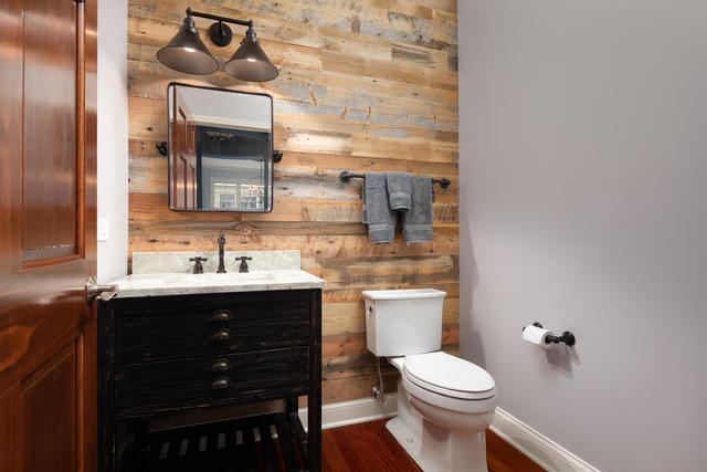 1731 Elyse Lane Naperville, IL 60565 - Photo 13 of 34 a bathroom with a toilet sink and mirror