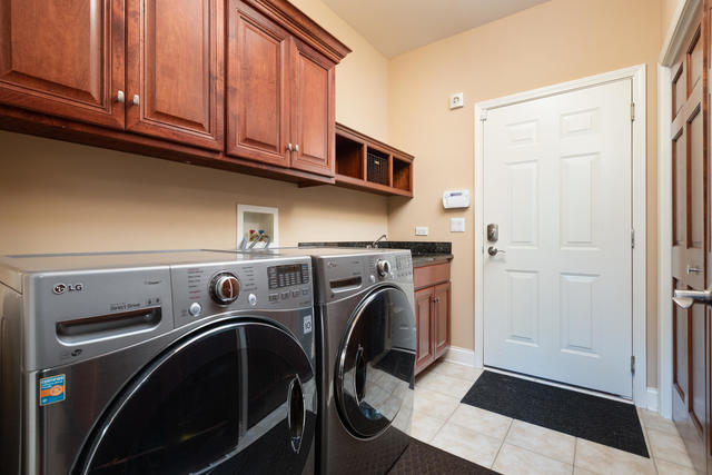 1731 Elyse Lane Naperville, IL 60565 - Photo 14 of 34 a utility room with dryer and washer