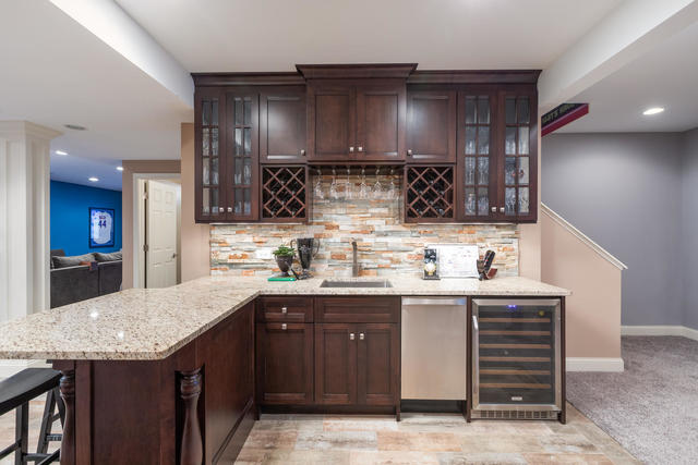1731 Elyse Lane Naperville, IL 60565 - Photo 28 of 34 a kitchen with granite countertop a sink a stove and cabinets