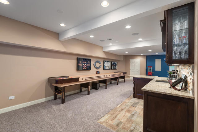 1731 Elyse Lane Naperville, IL 60565 - Photo 30 of 34 a living room with furniture and a table