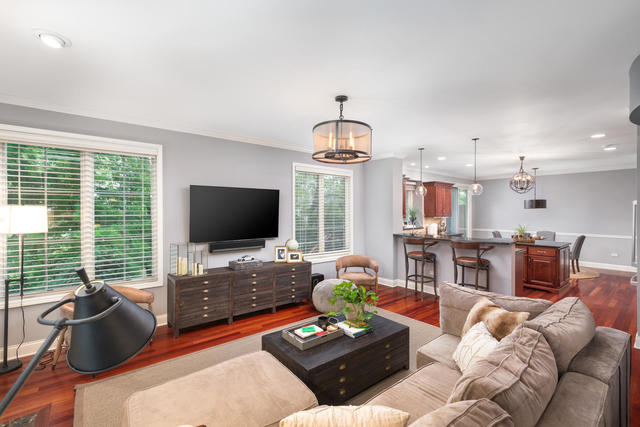 1731 Elyse Lane Naperville, IL 60565 - Photo 7 of 34 a living room with furniture and a flat screen tv