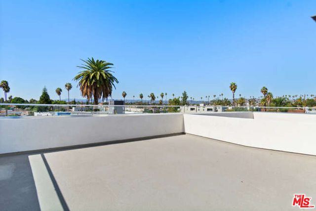 a view of a swimming pool and a yard