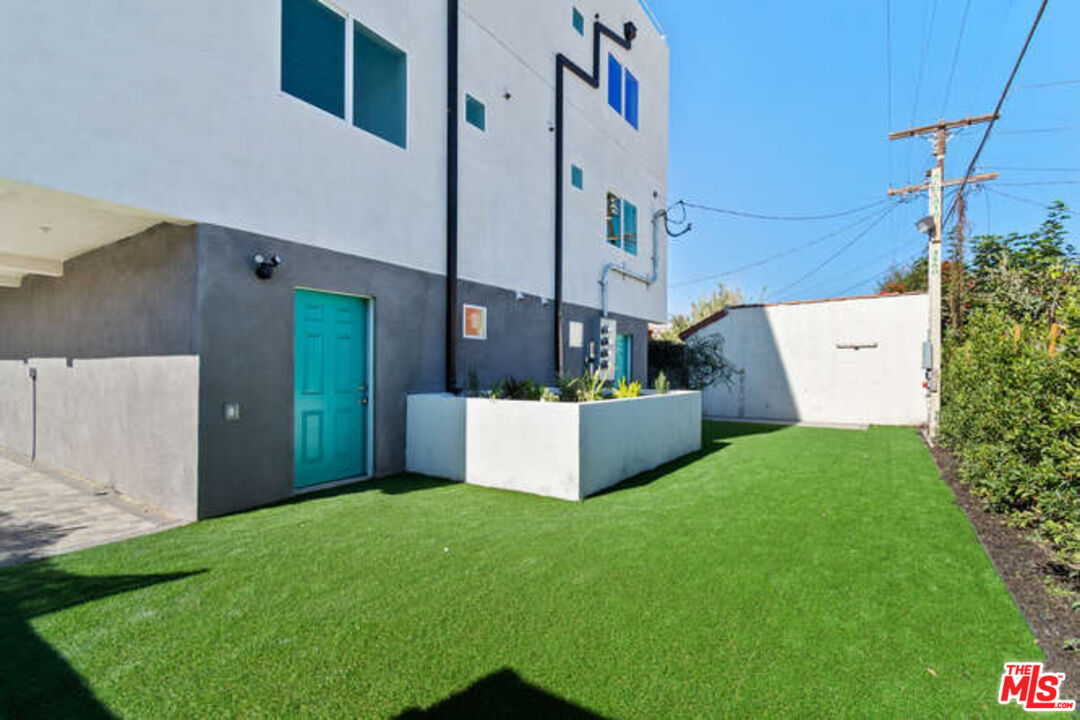 2636 Virginia Road Los Angeles, CA 90016 - Photo 30 of 31 a view of a house with a wall and a window