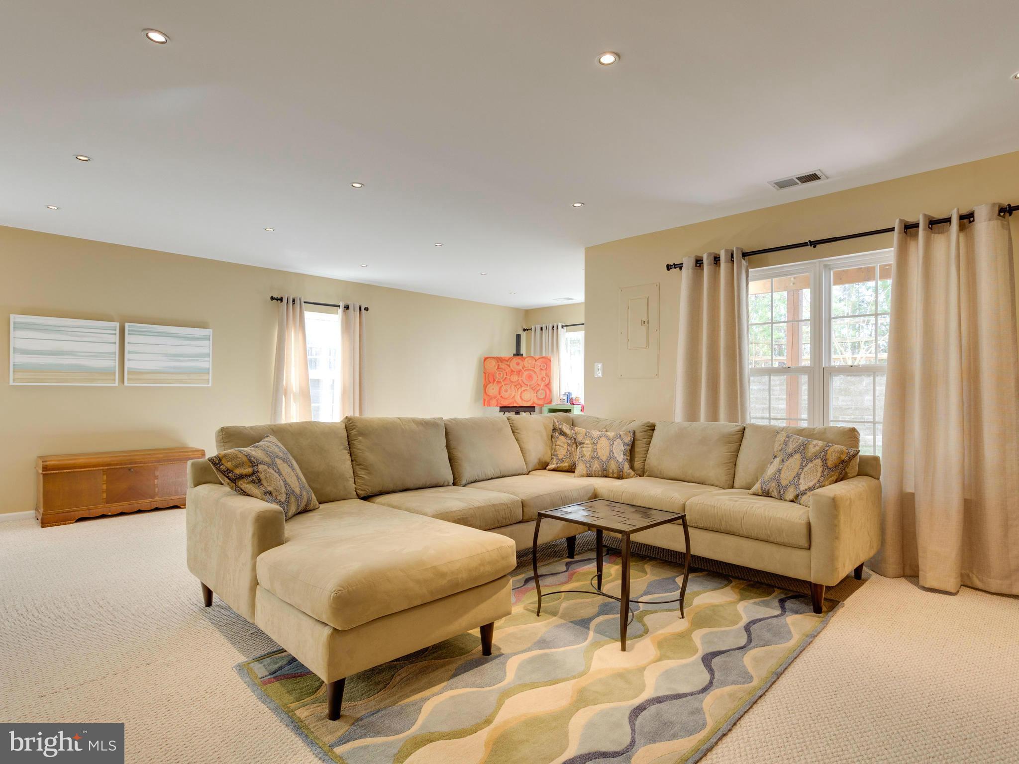 7310 Hampton Manor Place Springfield, VA 22150 - Photo 22 of 30 a living room with furniture and a large window