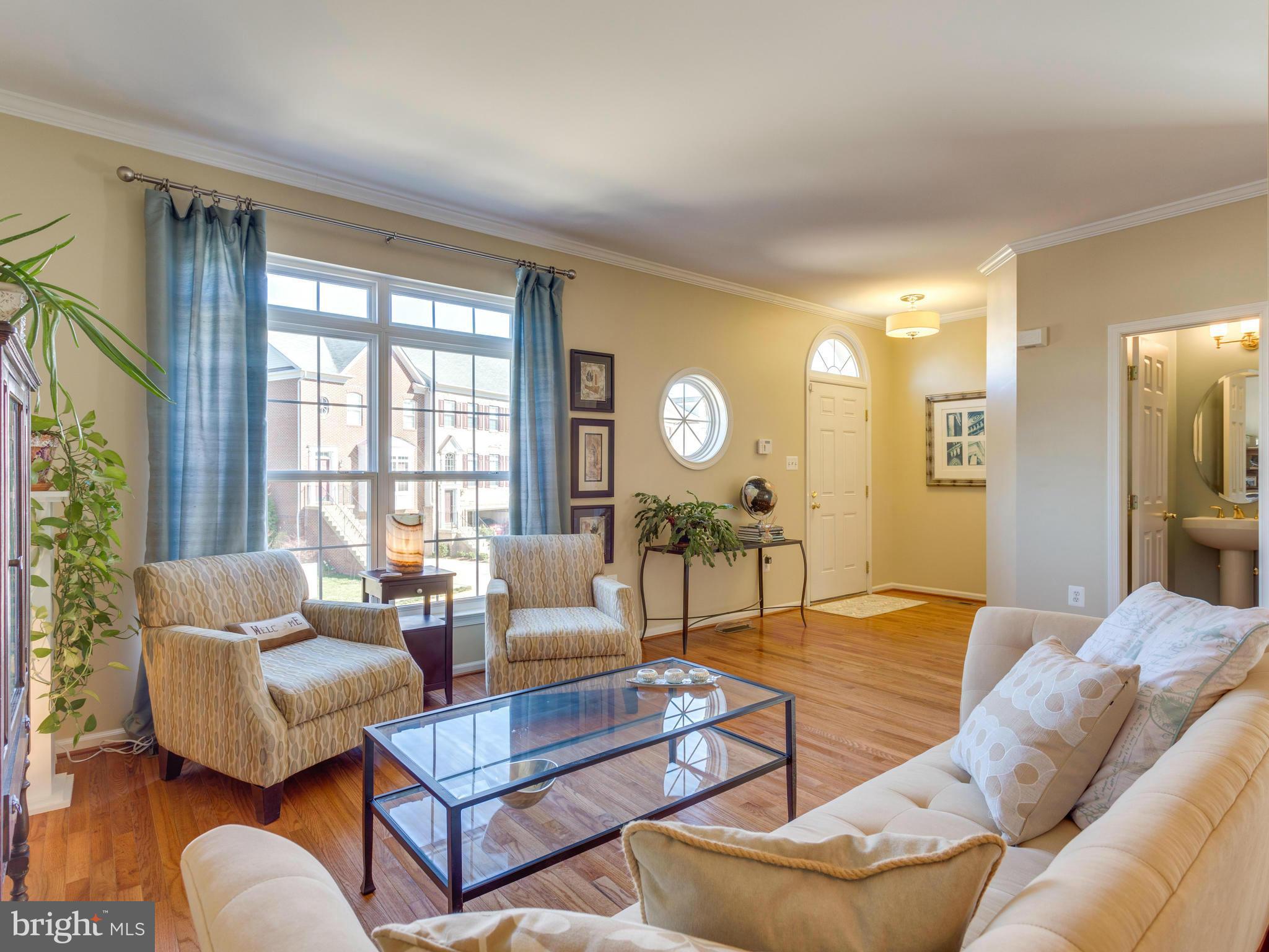 7310 Hampton Manor Place Springfield, VA 22150 - Photo 5 of 30 a living room with furniture and a large window