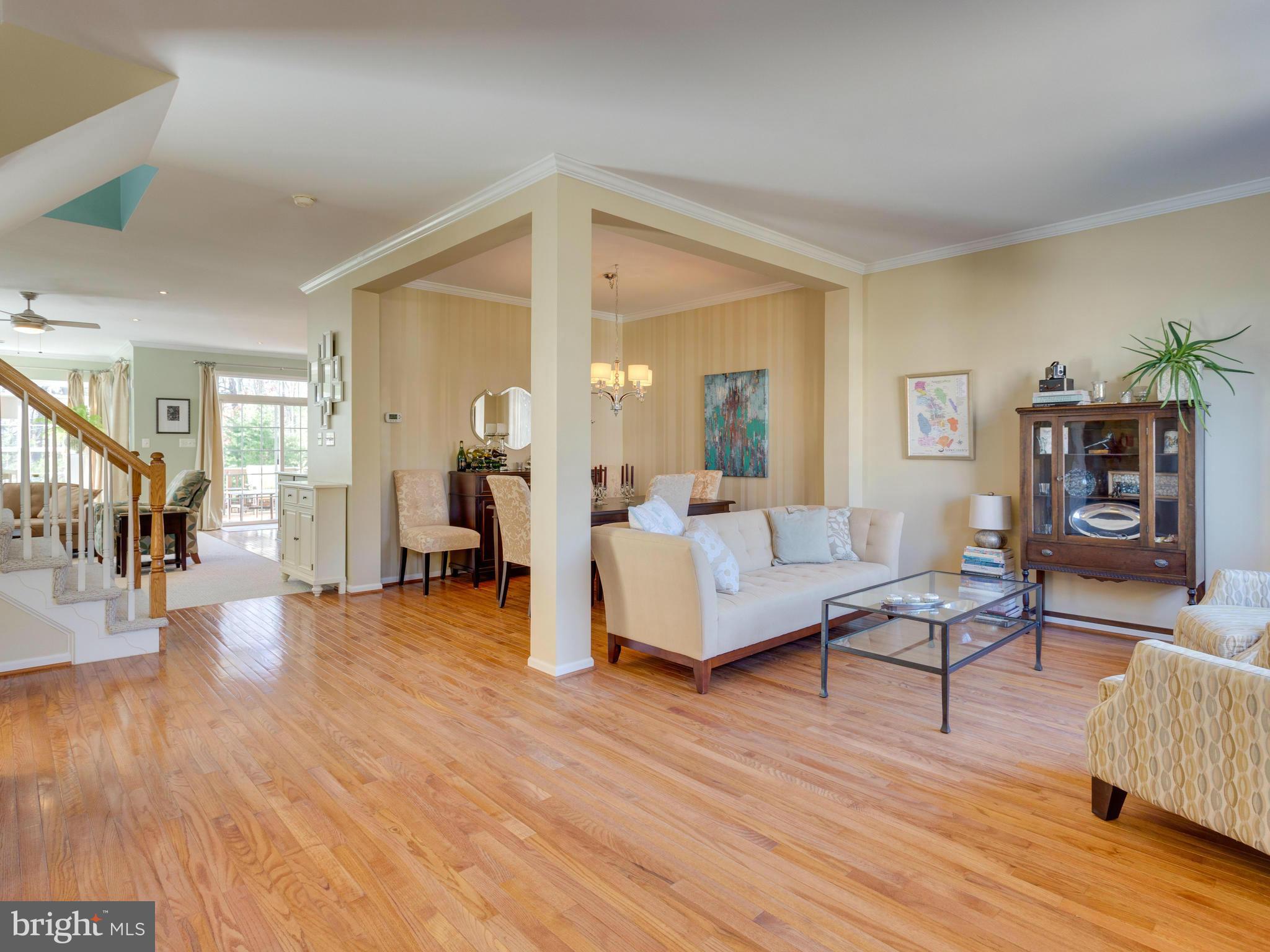 7310 Hampton Manor Place Springfield, VA 22150 - Photo 8 of 30 a living room with furniture and wooden floor