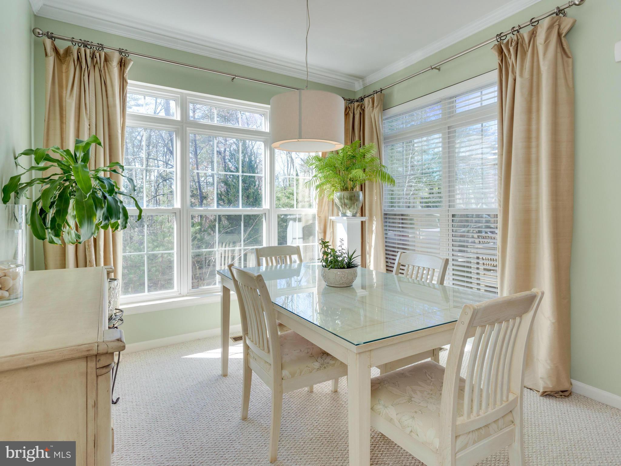 7310 Hampton Manor Place Springfield, VA 22150 - Photo 10 of 30 a view of a dining room with furniture and window