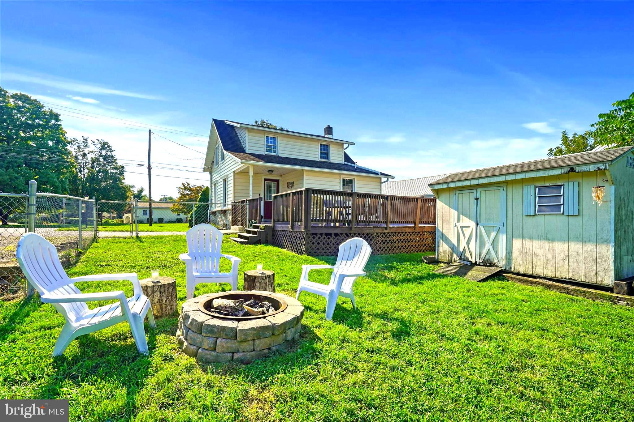 108 South Line Road Stevens, PA 17578 - Photo 7 of 24 a backyard of a house with barbeque oven table and chairs
