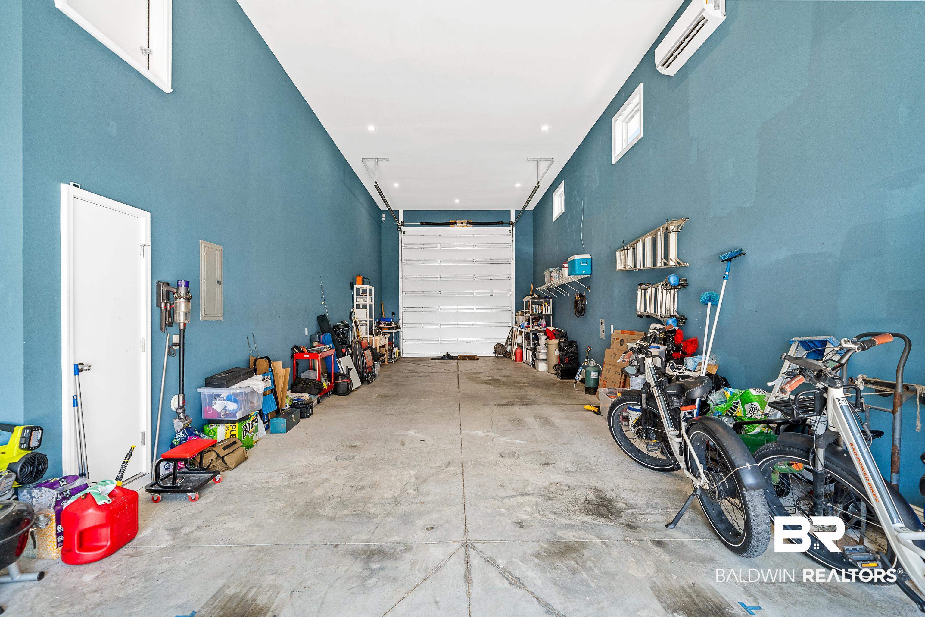 12329 Reunion Place, Unit LOT 38 Foley, AL 36535 - Photo 21 of 43 Garage with an AC wall unit and electric panel