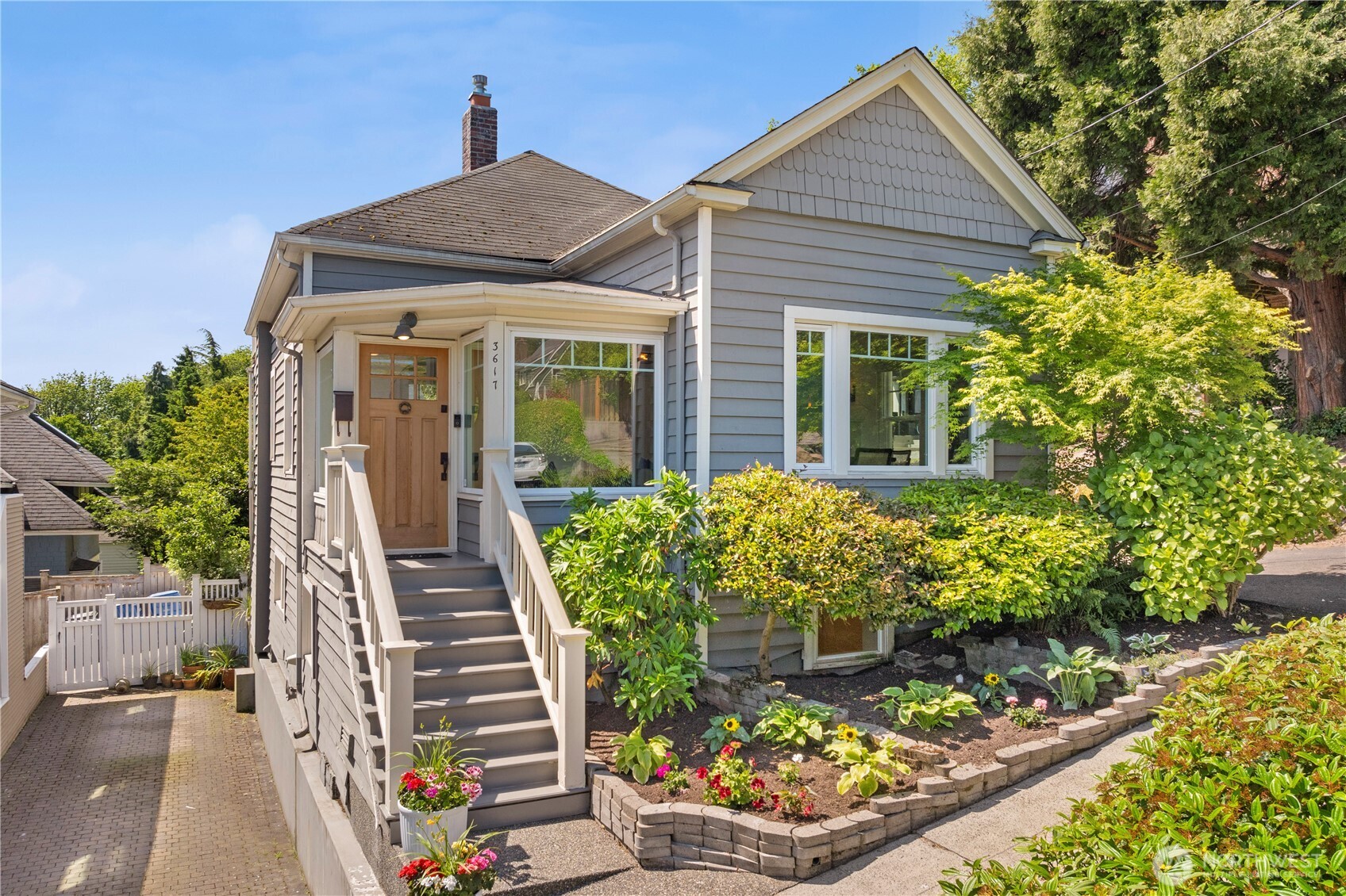 3617 East Cherry Street Seattle, WA 98122 - Photo 1 of 34 a front view of a house with a yard