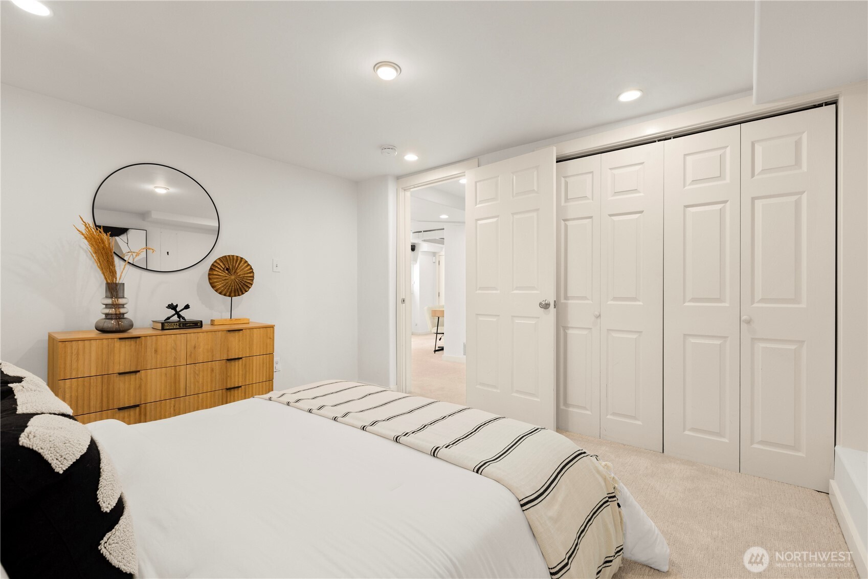 3617 East Cherry Street Seattle, WA 98122 - Photo 27 of 34 a bedroom with bed and a chandelier