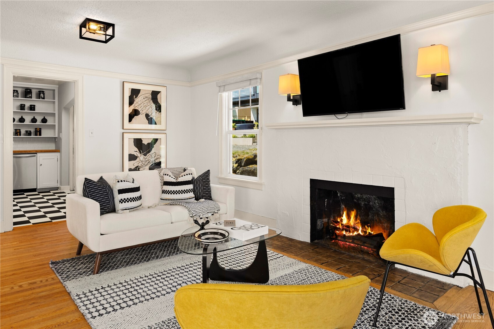 3617 East Cherry Street Seattle, WA 98122 - Photo 6 of 34 a living room with furniture a flat screen tv and a fireplace