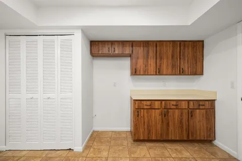 a view of a kitchen with cabinets
