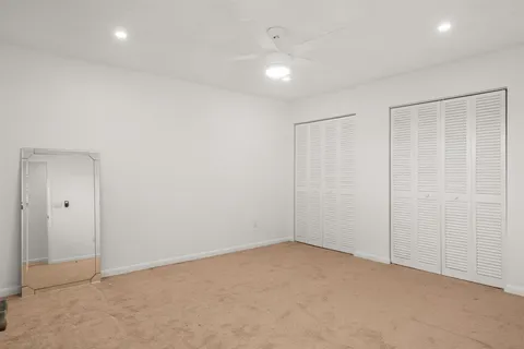 a view of a room with wooden walls